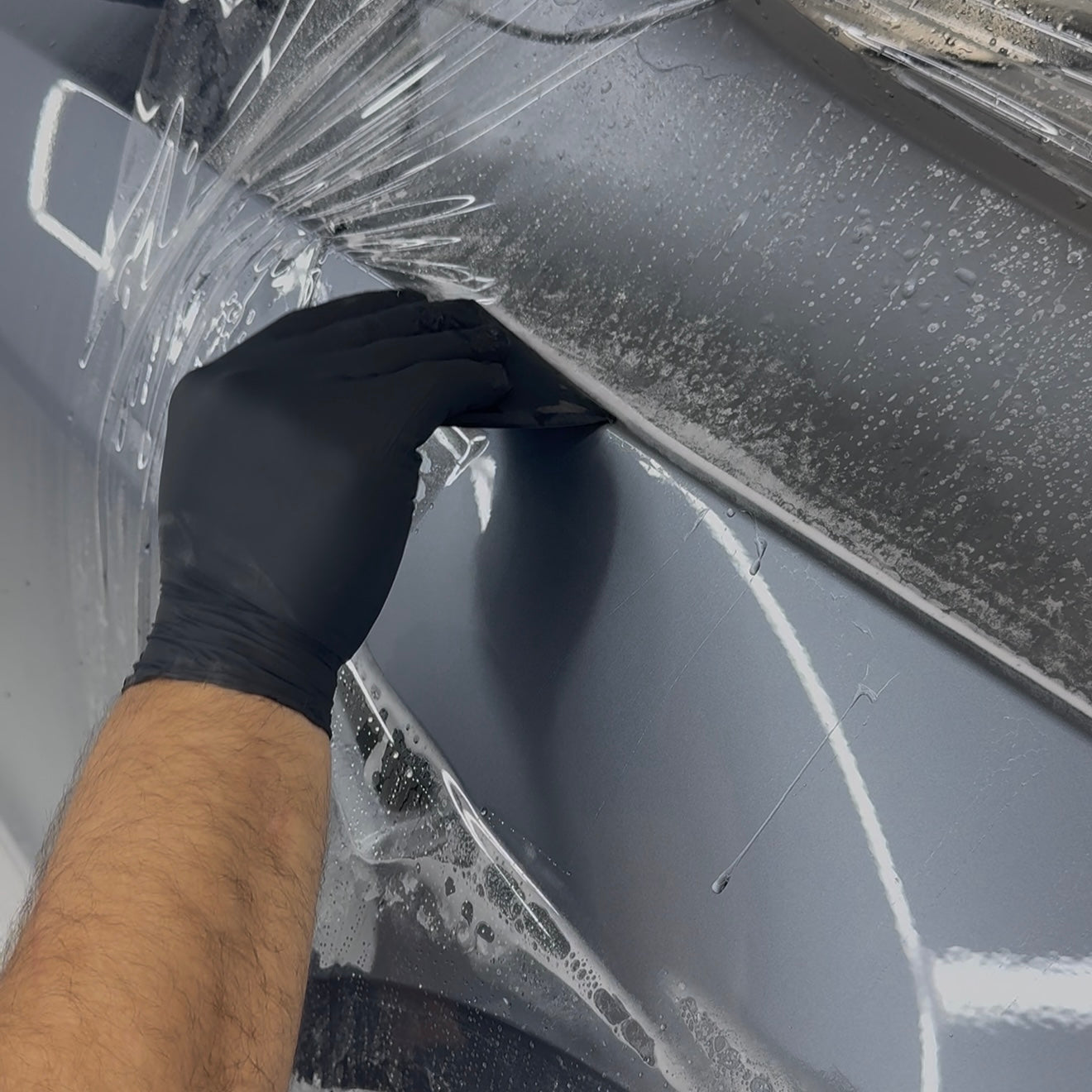 Close-up of PPF edge with near-invisible finish on fender