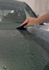 Applying colored paint protection film (PPF) on vehicle hood at WrapState – custom color and protection in NJ and Florida